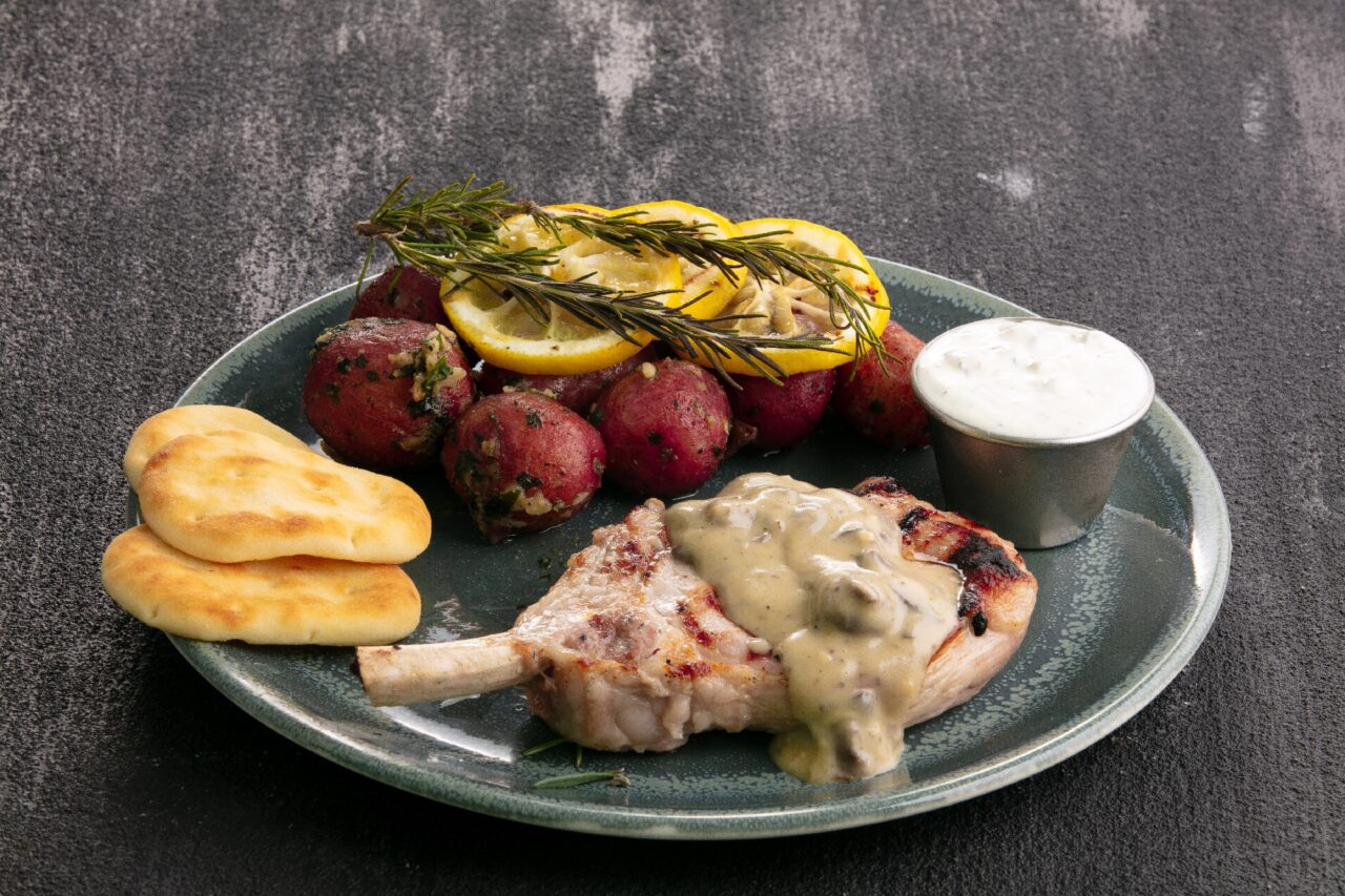 Grilled Pork Chops with Mushroom Sauce and Greek Seasoned Potatoes - Gordon Food Service